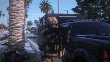 a man holding a gun in front of a police car