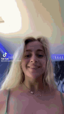 a woman 's face is shown in a tik tok video .