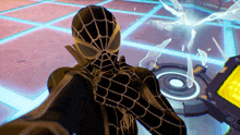 a spider man is standing in front of a screen that says ' spider-man ' on it