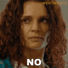 a close up of a woman 's face with the word no written on her face