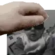 a close up of a person 's hand holding a baby 's face .