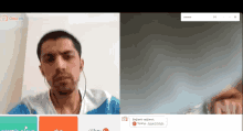 a man is on a video call with a website called omr.tv in the background