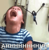 a child is screaming with the words ahhhh written on the bottom of the image