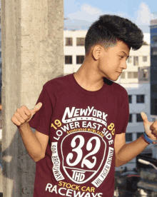 a young man wearing a t-shirt that says new york lower east side 32