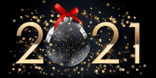 a christmas ball with a red bow is surrounded by confetti and the year 2021 .