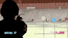 a pixelated image of a person shooting a gun with the words making of in the bottom right corner