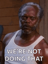a man with a beard is wearing a white tank top and saying `` we 're not doing that ''