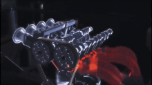 a computer generated image of a car engine with red flames