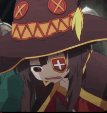 a girl wearing a red and yellow hat has a cross on her eye