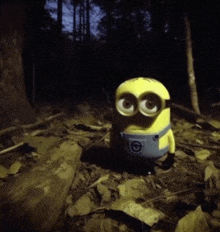 a yellow minion with big eyes is standing in the dark