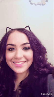 a woman with purple hair and cat ears on her head