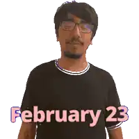 a man wearing glasses and a black shirt with the date february 23