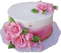 a white cake with pink roses and green leaves has the name sandra written on the top