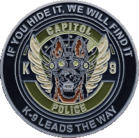 a coin that says k-9 leads the way