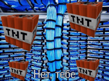 a bunch of tnt boxes are surrounded by a bunch of blue wires