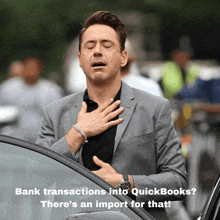 a man in a suit holds his hand to his chest with the words bank transactions into quickbooks below him