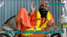 a man with a beard is sitting in a chair with the words get well soon god bless you