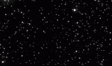 a lot of white stars are flying in the night sky