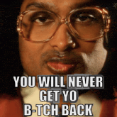 a man wearing glasses has the words you will never get yo b-tch back on his face