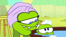 a cartoon character with a towel on her head washing another character in a tub