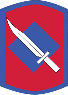 a red and blue emblem with a white sword