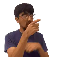 a man with glasses and a beard is pointing at something