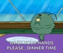 a cartoon character from spongebob squarepants is standing next to a plate and says `` wash your hands please dinner time '' .