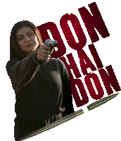 a woman holding a gun with the words don hai don behind her