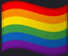 a close up of a rainbow flag on a black background .