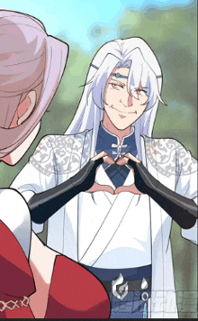 a man with white hair is making a heart with his hands