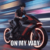 a man riding a motorcycle with the words on my way written on it