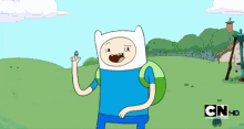 a cartoon character from adventure time is holding a coin in his hand