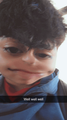 a boy making a face with the words well well well below