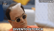 a man wearing sunglasses and a red shirt is making a funny face and says divento isterica