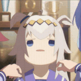 a girl with white hair and blue eyes is being held by another girl