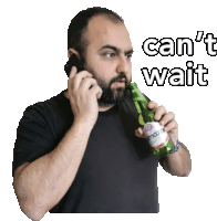 a man talking on a cell phone while holding a bottle that says ' can 't wait ' on it