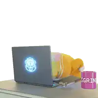 a stuffed animal sits at a desk with a laptop and a mug that says $ grin