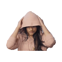 a woman wearing a pink hoodie covering her face with her hands