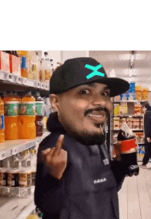 a man wearing a hat with the letter x on it