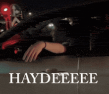 a person driving a car with the words haydeeee written on it