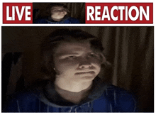 a man 's face is visible in front of a live reaction sign