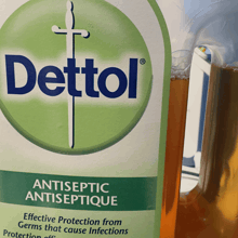 a bottle of dettol antiseptic antiseptique next to a bottle of liquid