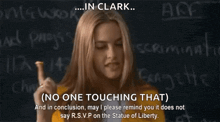 a woman is standing in front of a chalkboard with the words " no one touching that " written on it