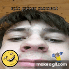 a close up of a man 's face with the words epic gamer moment written above