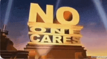 a sign that says " no one cares " on top of a building