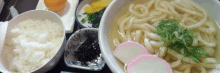 a bowl of noodles with rice and vegetables on a plate .