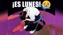 a man is sitting on a chair with his head on his knees and the words " es lunes " behind him