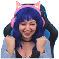 a woman with blue hair wearing headphones with cat ears on her head