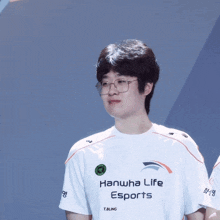a man wearing a hanwha life esports shirt