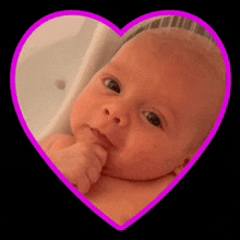 a picture of a baby in a pink heart